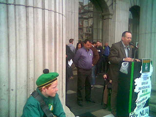 A young band member, Fergal Moore and Des Dalton, pictured at the GPO in Dublin on Easter Monday 2014.