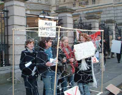 BODY activists in cage picture