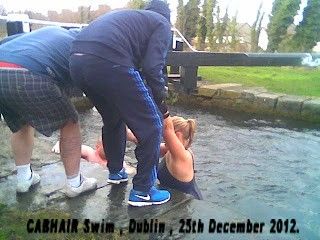 A female swimmer being assisted out of the water, as published on this site ('Indymedia') in 2012.