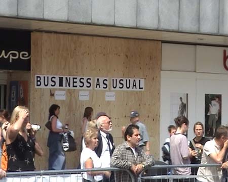 business as usual at boarded up shop