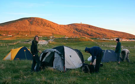 Pitching tents under Dooncarton Mountain: well over 100 people camped for the weekend