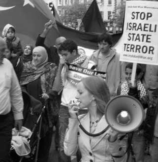 The speaker with a megaphone on Monday following the flotilla massacre