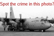 Hercules warplane at <font style='background-color:#88FF88;'>shannon</font>. Spot the crime in this photo?