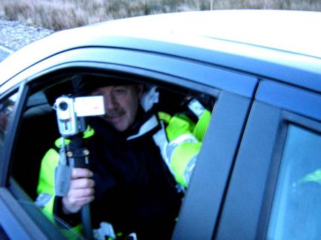 2007 Garda anti-war protest surveillance forgets a tripod needs a stable surface. 