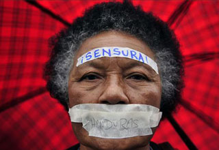 By far the best photo of the granny who couldn't spell censorship in Spanish under her umbrella. 