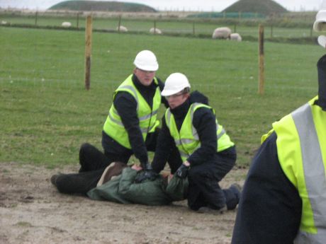 Protestor being held by security