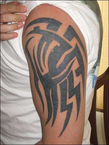 MIcheal Dwers tattoo while hanging around with "neo fascists", see the SS bit at bottom, bit odd, no?