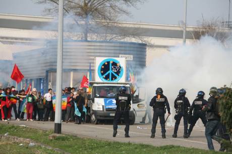 The police indiscrimately attacked evryone with teargas. this french peace movement with some elderly people were gassed and had an angry exchange with the Riot police.
