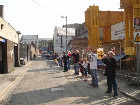 Round of applause after completion of  human chain around Moore Street. Photo taken in Moore Lane at the junction of O'Rahilly Parade.