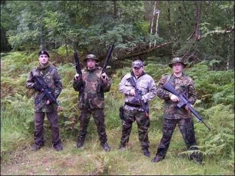 Michael "The Jackal" Dwyer (second from left) playing gun games with friends before Bolivian blood bath