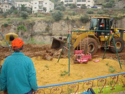 Abu Michel watching the destruction of his children's playground