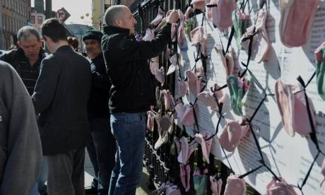 Protesters tying shoes to railings at the Pro Cathedral