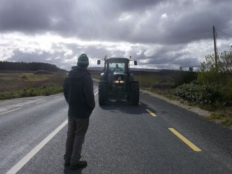 Carey's tractor stopped in the road