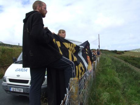 Supporters on dry land, with banners of support, in spite of the Garda presence