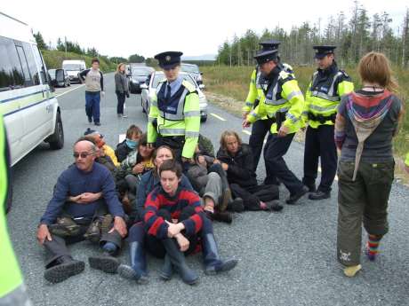 Rolling blockade leading to Shell tractor reversing back into refinery