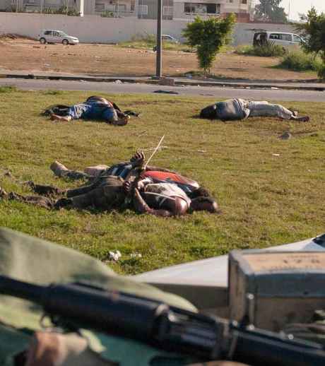 Black Africans murdered by NATO-Financed Mercenaries in Libya - Note the cuffs on the hands of the dead men