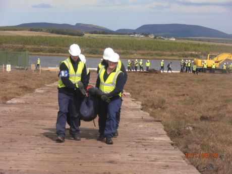 Click on image to see full-sized version IRMS security carrying people off site