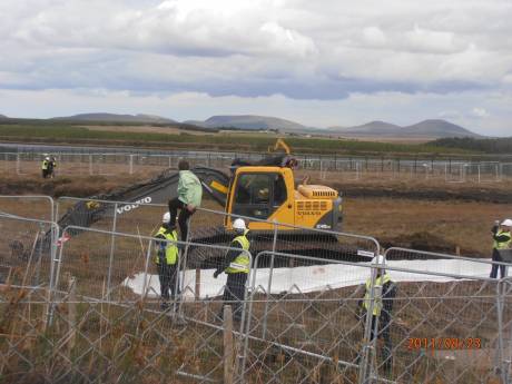 Someone on top of a digger, stayed up 4 hours