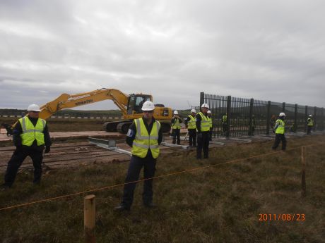 digger stopped working, this is where they are putting up palisade fencing round the back