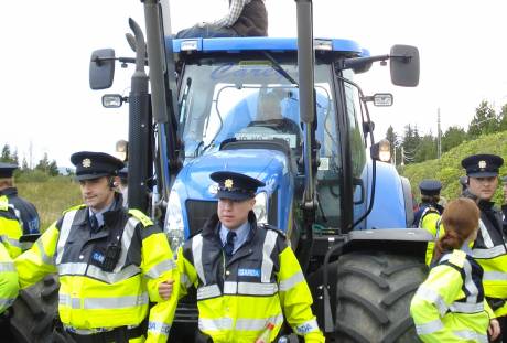 gards play ring a roses with a tractor