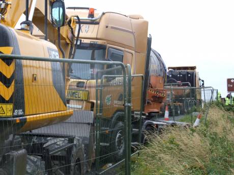 Truck listing into ditch