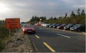 Cars and people gather