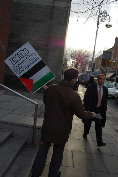 IPSC activists pass out leaflets to the public