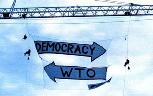 Democracy one way, WTO other way - famous banner drop Seattle '99