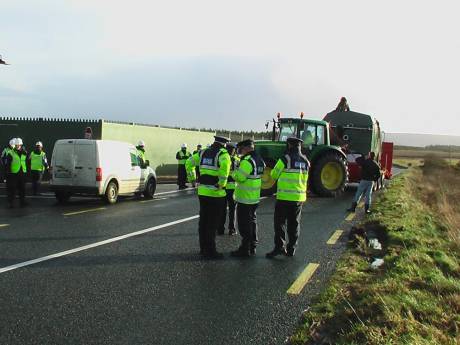 Gates to compound blocked by campaigners