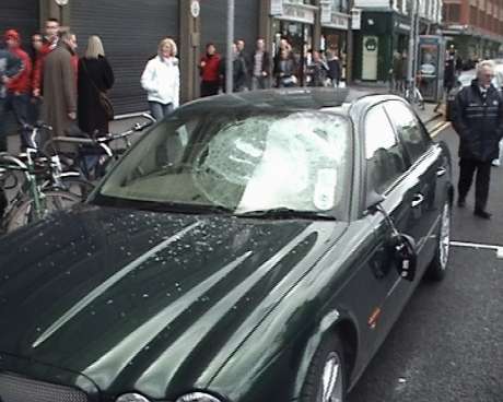 Smashed window of car in Nassau Street (before being set alight)