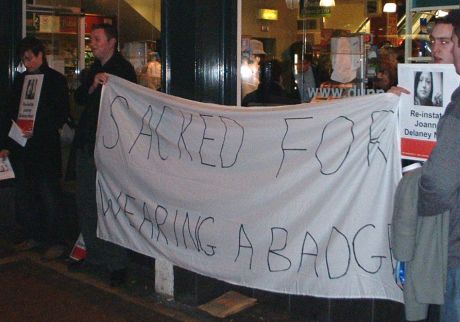 sacked for wearing a badge