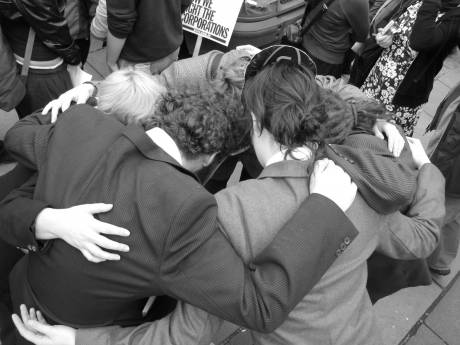 The Corrupt Politicians' Bloc prepares for the demo with a group hug