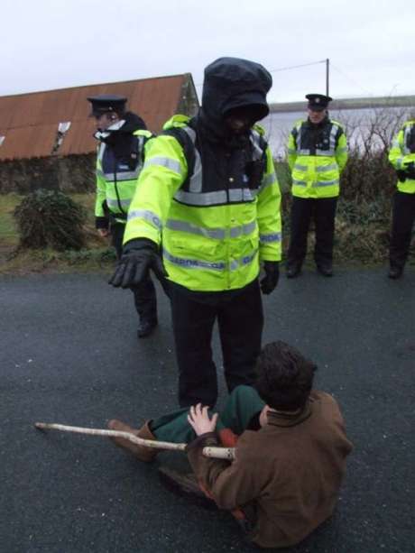 Person being pushed out of the road by Garda