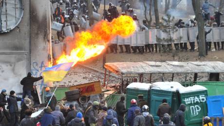 A protester sprays fire in the direction of the riot police during clashes in the centre of Kiev (AFP Photo / Genya Savilov)
