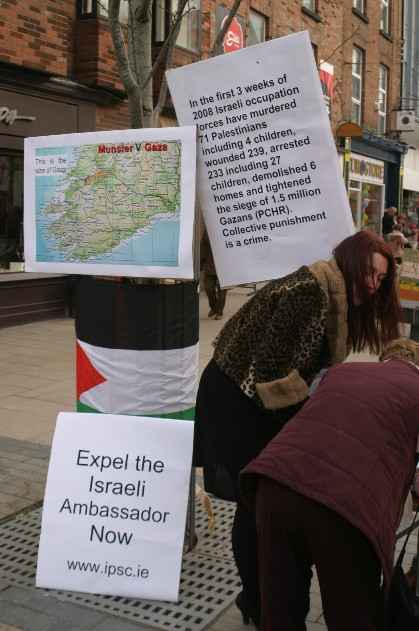 IPSC Stall showing map of Gaza V Munster and the number of palestinians murdered, wounded and arrested in the last three weeks.