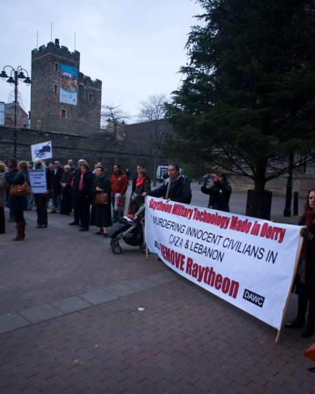 Banner at the Rally in Derry against Israel's attacks on Gaza:  "Raytheon Military technology Made in Derry, MURDERING INNOCENT CIVILIANS  IN GAZA & LEBANON.  REMOVE Raytheon" 
