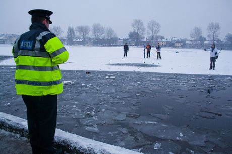 The boys are shocked that the Gardai are breaking the ice without telling them beforehand so that they could get off the lake..