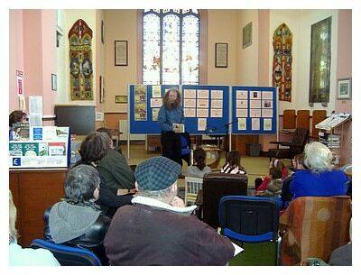 Storyteller Eddie Lenihan reading at a previous festival