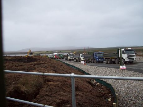 A line of trucks backed up at the Aughoose compound