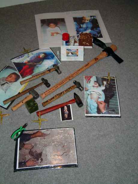 Hammers & photos of Iraqi's left at the scene of the disarmament at Shannon Airport Feb 2003