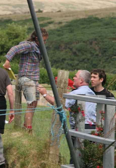 Telling protesters to leave private property and go back onto road, moments after telling them to get off the road