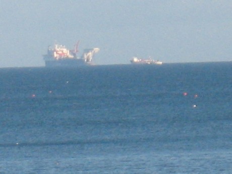 The Solitarie and a supply ship on the horizon