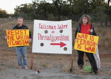Click on image to see full-sized version Veteran members of the Catholic Worker movement Jim Dowling and Ciaron O'Reilly prepare to block a major access road to the Talisman Sabre military exercise