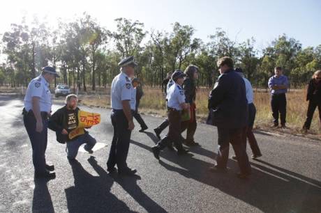 Click on image to see full-sized version Police arresting Anti-War activists Jim Dowling and Ciaron O’ Reilly for blocking military access to the Talisman Sabre training facility