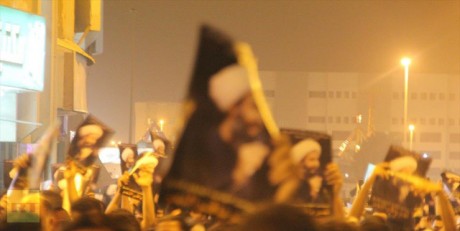 Protesters carrying portraits of Sheikh Nimr Baqir Al-Nimr 