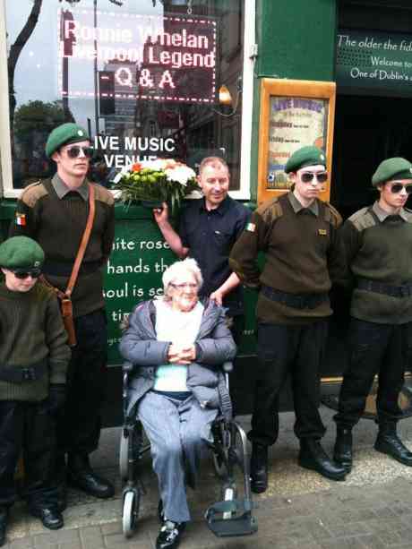 NFÉ members on Bachelors Walk, Dublin,  with family members of Mary Duffy who was brutally murdered by British Forces on Bachelors Walk, 26th of July, 1914. Pictured in the photo is the granddaughter of Mary Duffy.