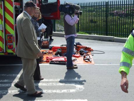 Media arrive just in time to see protesters cut out and released.