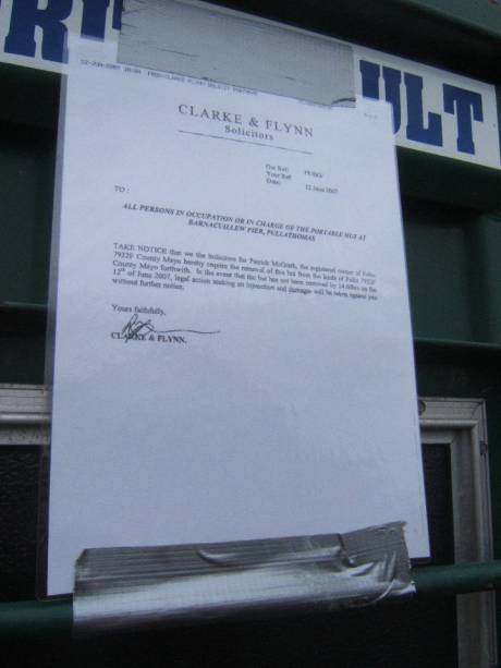 Solicitors letter posted on the illegal cabin. 