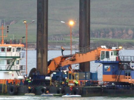 Kayakers on the side, while the ninja stands on the crane