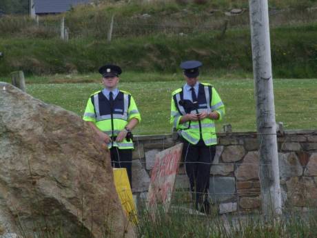 Two Gardai hanging about the camp gates all day